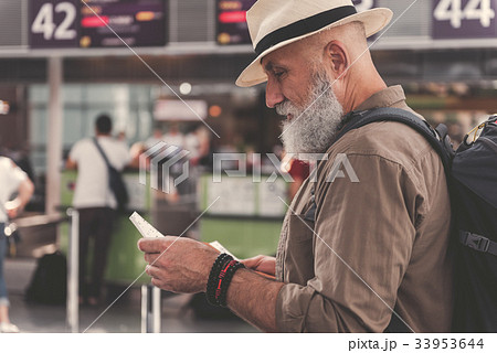 Serious bearded retire watching at cheque 33953644