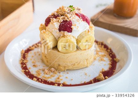 Hot cake with cream, strawberry, banana, cookie 33954326