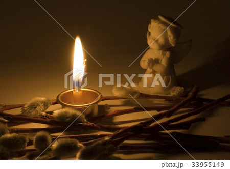 Angel and burning candle Angel and burning candle 33955149