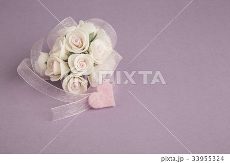 rose and ribbon on purple background 33955324
