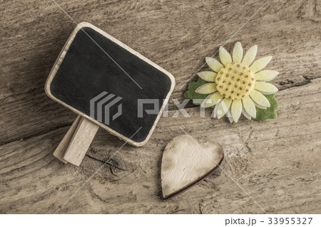 wooden heart and an empty chalkboard 33955327