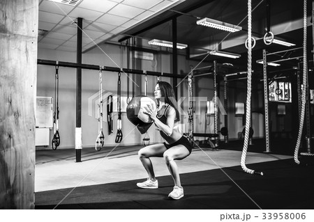 Woman training with functional gymnastic in the Woman training with functional gymnastic in the 33958006