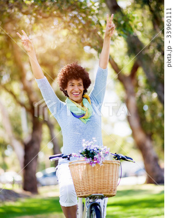 Happy young woman with bicycle Happy young woman with bicycle 33960111
