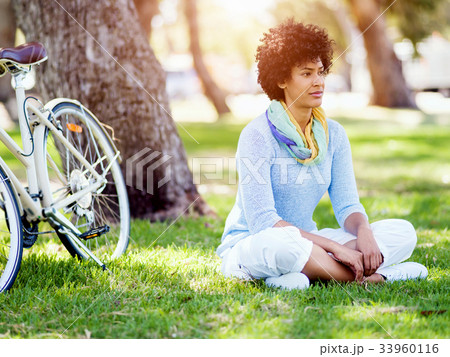 Happy young woman with bicycle Happy young woman with bicycle 33960116