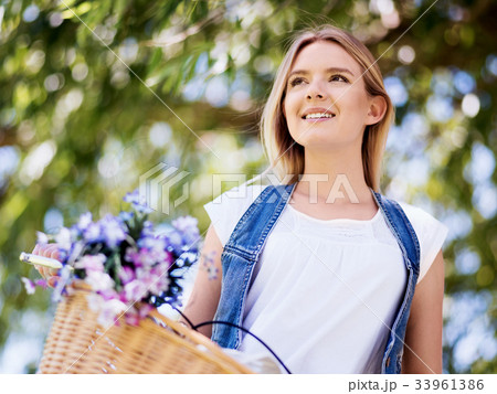 Happy young woman with bicycle 33961386