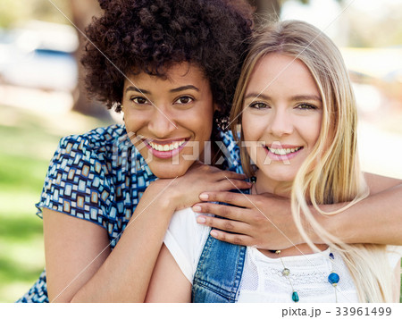 Two women friends in park Two women friends in park 33961499