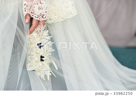 Garter on the leg of a bride, Wedding day moments 33962250
