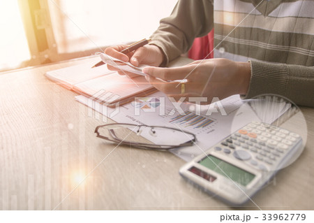 Business man pointing on data paper 33962779