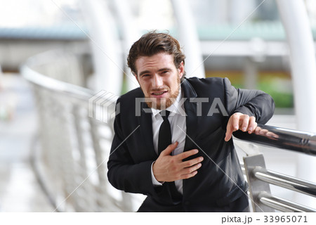 Business man with beard having heart attack. Business man with beard having heart attack. 33965071