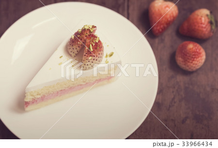 close up of strawberry cream cake on white 33966434