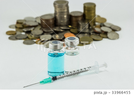 Vaccine with syringe and money white background. Vaccine with syringe and money white background. 33966455