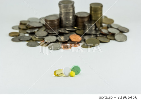 Medicine and money on white background.  33966456