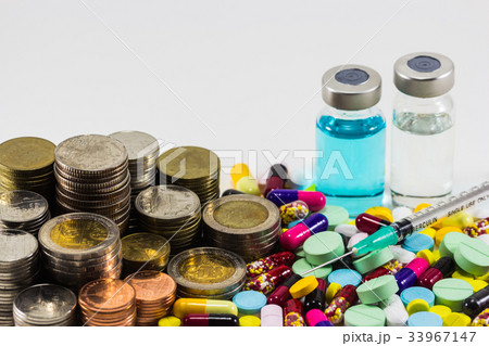 Medicine with money and syringe on 33967147