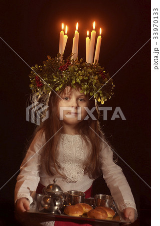 Little caucasian girl in Saint Lucia costume Little caucasian girl in Saint Lucia costume 33970133
