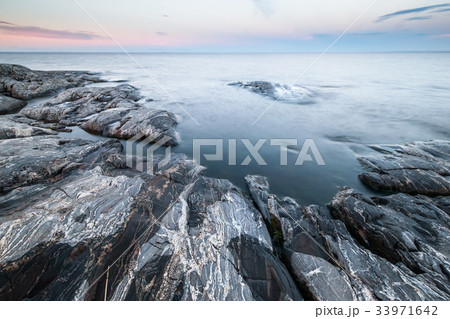 Morning minimalist landscape of stony coast. Morning minimalist landscape of stony coast. 33971642