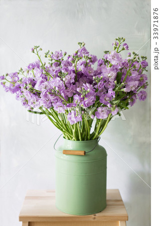 Garden scene with flowers in vintage metal cans 33971876