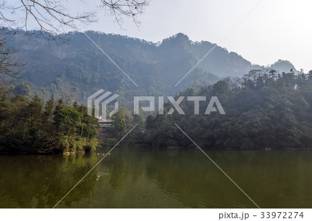 Large lake between mountains under sky 33972274