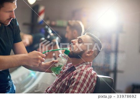 Young man at the barbershop Young man at the barbershop 33978692