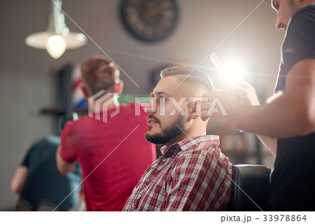 Young man at the barbershop 33978864