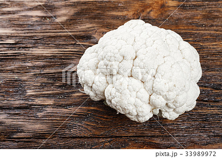 white cauliflower on a wooden background white cauliflower on a wooden background 33989972
