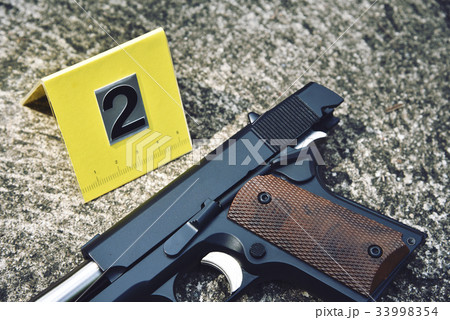 Crime scene investigation, Pistol with blood stain 33998354