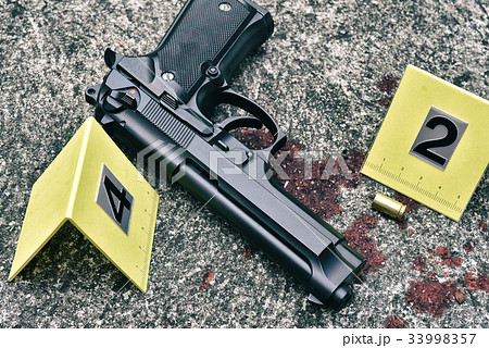 Crime scene investigation, Pistol and bullet shell Crime scene investigation, Pistol and bullet shell 33998357