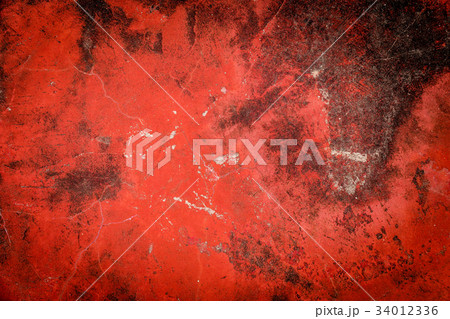 red cracked paint on old concrete 34012336