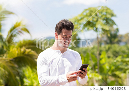 Handsome Man Messaging With Cell Smart Phone Over 34016298