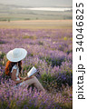 Romantic woman with book on lavender field 34046825