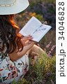 Romantic reading woman with book on lavender field 34046828