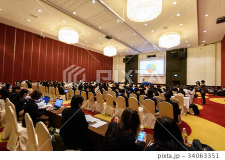 Blurry image in conference room.  34063351