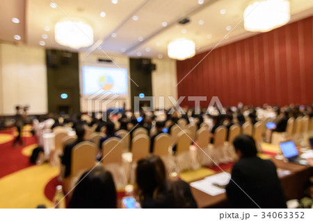 Blurry image in conference room. Blurry image in conference room. 34063352