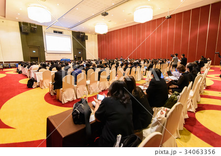 Blurry image in conference room.  34063356