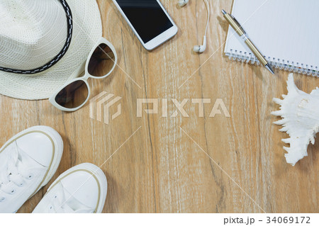 Top view of travel stuff. Essential travel items. 34069172