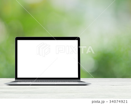 Laptop with blank screen placed on white wooden Laptop with blank screen placed on white wooden 34074921