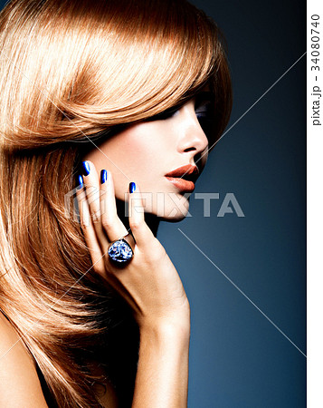 woman with sapphire jewelry ring on finger woman with sapphire jewelry ring on finger 34080740