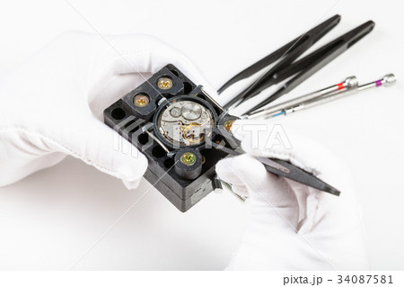 repairing of mechanical watch with tweezers repairing of mechanical watch with tweezers 34087581