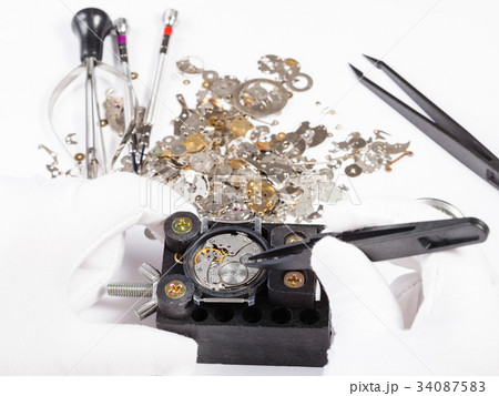 repair of mechanic wristwatch with spare parts 34087583