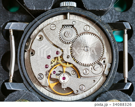 used watch fixed in plastic holder for repairing 34088326