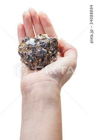above view of mineral ore on female palm above view of mineral ore on female palm 34088694