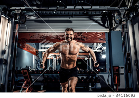 Bodybuilder Is Working On His Chest With Cable Bodybuilder Is Working On His Chest With Cable 34116092