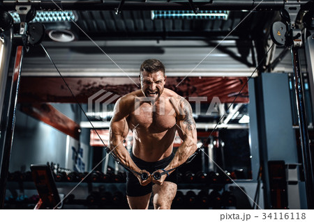 Bodybuilder Is Working On His Chest With Cable Bodybuilder Is Working On His Chest With Cable 34116118