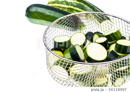 Young zucchini, cut into slices Young zucchini, cut into slices 34119997