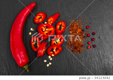 Spice in cooking red chili pepper on black stone 34123042