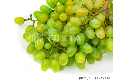 Branch of green grapes on white background 34125438