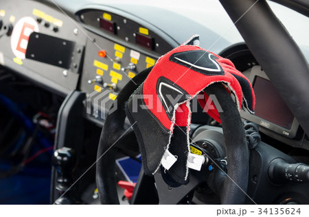 耐久レース車の運転席とレーシンググローブの写真素材