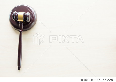 a gavel on a wooden brown desktop, Law, lawyer and justice conce 34144226