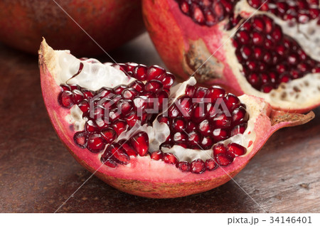 Pomegranate on a timber board 34146401