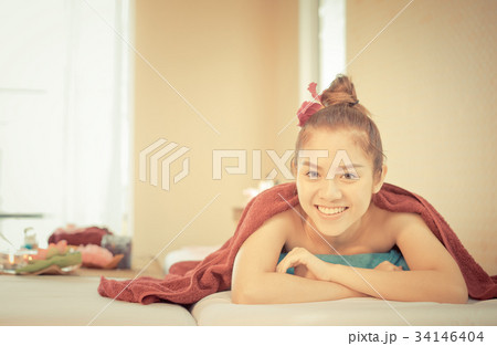 Happy asian women is lying on Spa Bed 34146404
