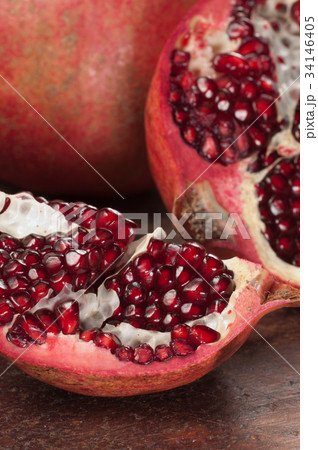 Pomegranate on a timber board 34146405